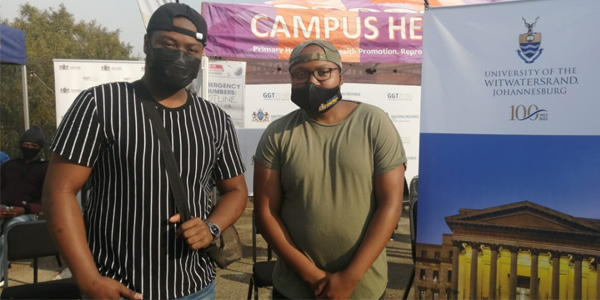 (l-r) Protected from the virus Tisetso Leshilo and Nare Moseu place trust in science (l-r) Protected from the virus Tisetso Leshilo and Nare Moseu place trust in science
